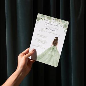 May include: A Quincea&ntilde;era invitation card held by a hand. The card features an illustration of a girl in a green gown, with the text "Please join us for the Quincea&ntilde;era of our daughter Rosie Rodriguez". The event details are also included.