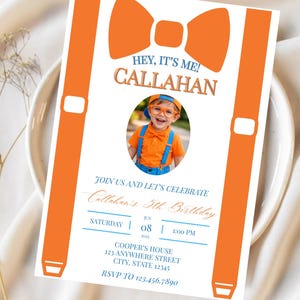 May include: A rectangular birthday invitation card featuring a large orange bow tie and orange suspenders graphic. The text reads: HEY, IT'S ME! CALLAHAN, JOIN US AND LET'S CELEBRATE, Callahan's 5th Birthday, SATURDAY, JUN 08, 2025, 1:00 PM, COOPER'S HOUSE.