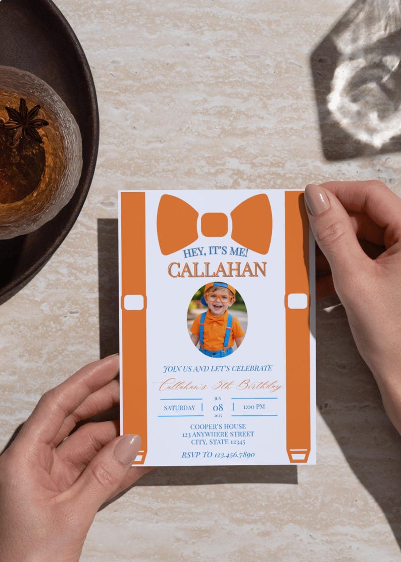 May include: A rectangular birthday invitation card featuring a large orange bow tie and suspender graphic. The text reads HEY, IT'S ME! CALLAHAN, JOIN US AND LET'S CELEBRATE, Callahan's 5th Birthday, SATURDAY 08 1:00 PM, COOPER'S HOUSE 123 ANYWHERE STREET, RSVP TO 123.456.7890.