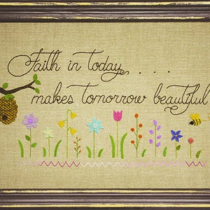 May include: Embroidered artwork with a quote: "Faith in today... makes tomorrow beautiful". The artwork features a bee, a honeycomb, and a row of colorful flowers.