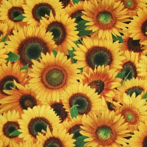May include: A close-up of a fabric with a repeating pattern of yellow sunflowers. The sunflowers are in various stages of bloom, with some fully open and others still in bud. The fabric is a light yellow color with a subtle green background.