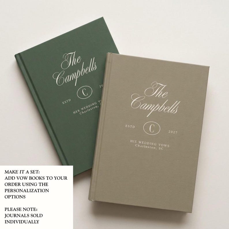 May include: Two hardcover journals, one dark green and one taupe, featuring white embossed text. The green journal reads The Campbells, ESTD, C, 2027, HER WEDDING VOWS, Charleston. The taupe journal reads The Campbells, ESTD, C, 2027, HIS WEDDING VOWS, Charleston, SC.