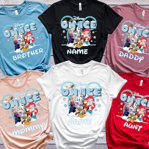 a collection of Disney-themed t-shirts, each featuring a different character from the Disney film "On Ice". The t-shirts are arranged in a grid-like pattern, showcasing various colors and designs.