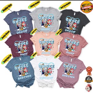 a collection of Disney-themed t-shirts, each with a unique design featuring characters from the Disney movie "On Ice". The t-shirts are arranged in a grid pattern, showcasing various colors and styles.