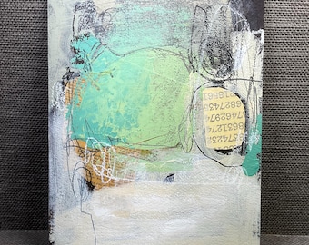 May include: Abstract mixed media painting with a textured surface. The artwork features a central light green shape, surrounded by white, black, and teal accents. Sections of text and scribbled lines add detail. Signed by the artist.