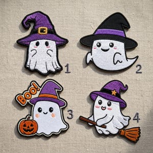 May include: Four embroidered patches featuring white ghosts with black outlines. Patch 1 shows a ghost in a purple hat. Patch 2 shows a ghost in a black hat with a purple band. Patch 3 shows a ghost in a purple hat with a pumpkin and the text Boo. Patch 4 shows a ghost in a purple hat riding a broomstick.