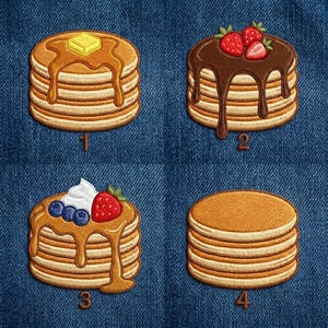 May include: Four embroidered patches of pancake stacks on a blue denim background. Patch 1 has butter and syrup. Patch 2 has chocolate sauce and strawberries. Patch 3 has syrup, whipped cream, blueberries, and a strawberry. Patch 4 is plain.