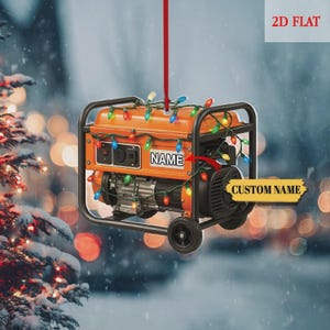 May include: Orange generator ornament with a black frame, wheels, and a string of colorful lights. The ornament has the word "NAME" and "CUSTOM NAME" on it. The ornament is hanging from a red string.
