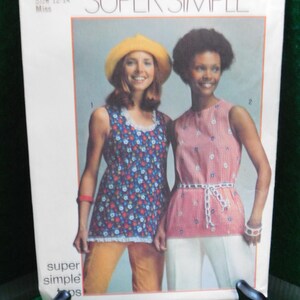 May include: A vintage sewing pattern for two sleeveless tops. The pattern is called "Super Simple" and is for sizes 12-14. The pattern shows two models wearing the tops, one with a floral print and the other with a gingham print.