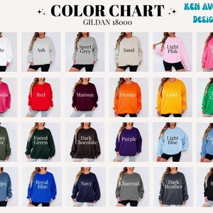 May include: A Gildan 18000 color chart by Ken Averie Designs featuring twenty-four crewneck sweatshirts in various colors including white, ash, sport grey, sand, light pink, safety pink, heliconia, red, maroon, orange, gold, green, blue, and black.