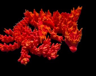 Dragón alado fénix de juguete, articulado, bicolor.