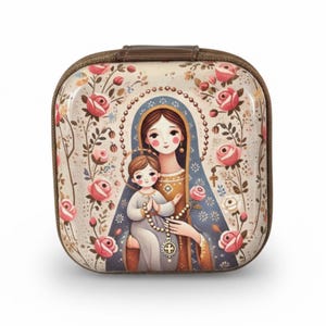 May include: A square, zipped case with a religious illustration. The artwork shows a woman and child surrounded by pink roses and foliage. The case has a brown zip and handle, with a glossy finish.