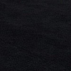 May include: A large, rectangular black rug with a textured surface. The rug is placed on a green surface, creating a contrast in color and texture. The rug's dark color suggests it could be used in various settings.
