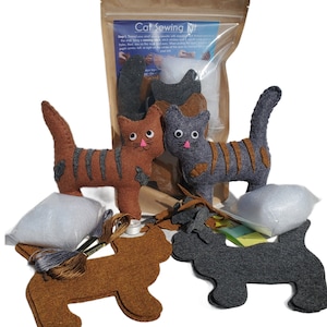 May include: A cat sewing kit with two felt cat shapes, one brown and one gray, with instructions and materials for making your own felt cat toys.