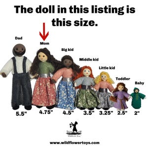 May include: A set of nine dolls of varying sizes, ranging from 2 inches to 5.5 inches tall. The dolls are dressed in different colors and patterns, and they are arranged in order of size from smallest to largest. The dolls are labeled with their corresponding sizes in inches.