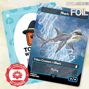 May include: A rectangular game card featuring a shark illustration with a captain's hat, blue water background, and text reading Shark, Token Creature - Shark, and Flying. A red circular seal states 100% Hand-Drawn and 100% Homemade.