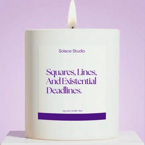 May include: A white soy wax candle with a lit wick. The candle has the text "Solace Studio" and "Squares, Lines, And Existential Deadlines" in purple. The candle is 9oz.