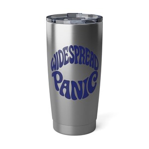 May include: A stainless steel tumbler with a black lid. The words "WIDESPREAD PANIC" are printed in a blue, retro font across the front of the tumbler. The tumbler is designed to keep beverages hot or cold.