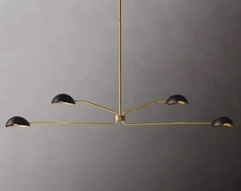 May include: A modern chandelier with a brass finish and four black, semi-circular shades. The light fixture has a central vertical rod with horizontal arms extending outwards, each holding a light. The design is minimalist and elegant.