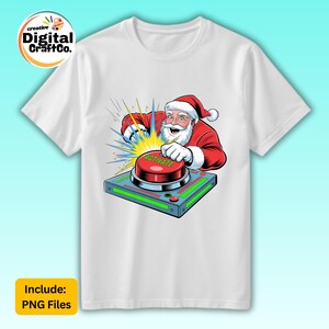 May include: White t-shirt featuring a cartoon Santa Claus pressing a large red button labeled "ACTIVATE". Santa is wearing a red suit and hat. The design includes yellow and blue burst effects. The shirt has the text "Include: PNG Files".