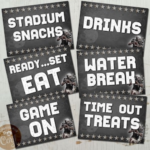 May include: Six black and white signs with a football theme. The signs read "Stadium Snacks", "Drinks", "Ready...Set Eat", "Water Break", "Game On", and "Time Out Treats".