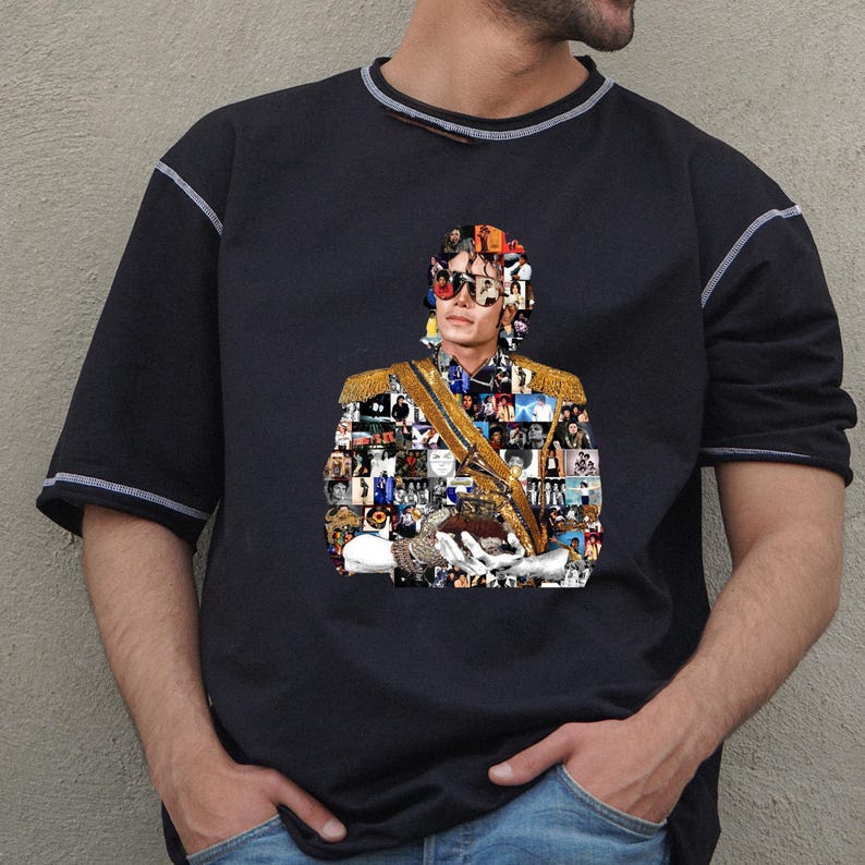 May include: Black short-sleeved t-shirt with a collage portrait of a person wearing sunglasses and a military-style jacket with gold detailing. The shirt has white stitching on the sleeves and neckline.