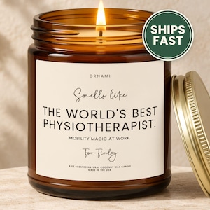 May include: A 9 oz scented natural coconut wax candle in an amber glass jar with a gold lid. The label reads: ORNAMI, Smells like THE WORLD'S BEST PHYSIOTHERAPIST. MOBILITY MAGIC AT WORK. For Finley. 9 OZ SCENTED NATURAL COCONUT WAX CANDLE MADE IN THE USA.