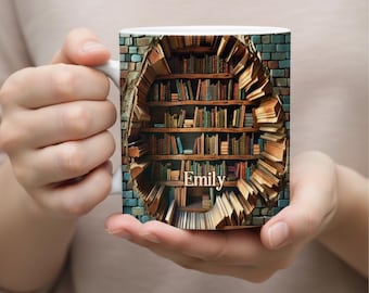 May include: White ceramic mug with a detailed illustration of a bookshelf set within a brick wall. The design includes a variety of books and the name "Emily". The mug is held in a person's hands.