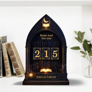 May include: A dark wooden bookshelf-shaped desk organizer with the text "Books read this year" and the numbers "215". The organizer has a crescent moon and open book design at the top, with the words "Amelia's Library" at the bottom.