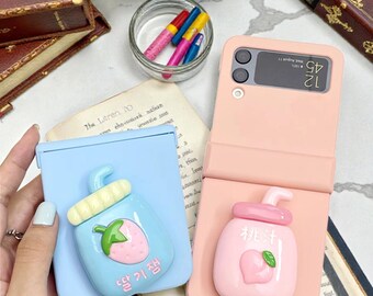 Galaxy Z フリップケース：ストロベリーピーチ柄、ホルダー付き、耐衝撃保護設計