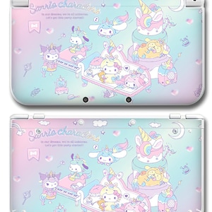 May include: A white Nintendo 3DS console with a pastel design. The design features Sanrio characters, unicorns, and the text "Sanrio characters". The design includes a piano, cake, and other whimsical elements.