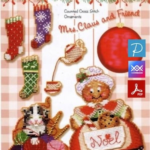 May include: A counted cross stitch pattern sheet titled Mrs. Claus and Friend featuring various Christmas ornaments including stockings, a teapot, a teacup, a cat with yarn, and Mrs. Claus holding a cookie with the text Noel on her apron.