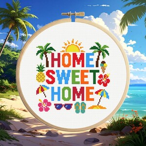 May include: A circular wooden embroidery hoop containing a cross-stitch pattern on white fabric. The design features the text HOME SWEET HOME in colorful block letters, surrounded by icons of palm trees, a pineapple, sun, hibiscus flowers, ice cream, umbrellas, sunglasses, and flip-flops.