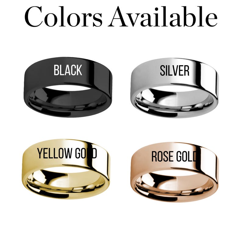 May include: Four rings are shown, each with a flat band and a different colour: black, silver, yellow gold, and rose gold. The colour of each ring is labelled on its surface. The text "Colors Available" is at the top of the image.