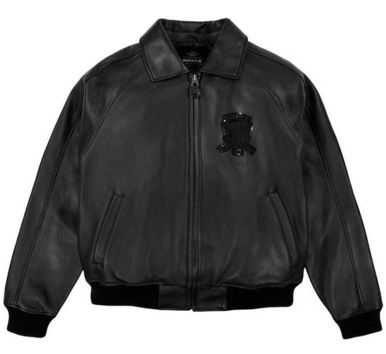 May include: A white ceramic mug with a black handle and the text "But First, Coffee" in a black, bold font. The mug is on a white surface. The mug is approximately 10 cm tall.