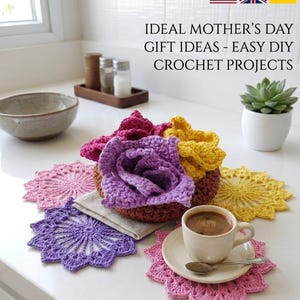 May include: A collection of handmade crochet projects, including colorful flower-shaped coasters and a central flower arrangement. The image features a cup of coffee on a coaster, with text that reads "IDEAL MOTHER'S DAY GIFT IDEAS - EASY DIY CROCHET PROJECTS."
