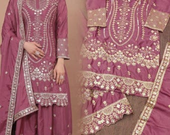 パキスタンのデザイナーによる刺繍シーケンスコーディング作業。既製のサルワール・カミーズウェディングウェアスーツ。