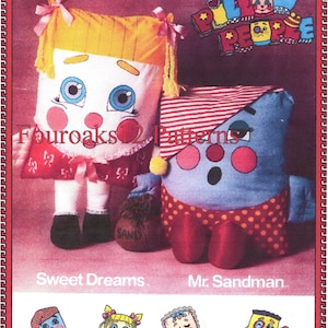 May include: Vintage Pillow People pattern showing two quirky pillow dolls. One has yellow hair and a red dress, the other is blue with a striped hat and polka-dot shorts. The image includes the text "Sweet Dreams" and "Mr. Sandman."
