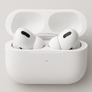 May include: White wireless earbuds in an open charging case. The earbuds have black accents and are positioned inside the white case. The case is open, revealing the earbuds, and is set against a white background. The product is designed for listening to audio.