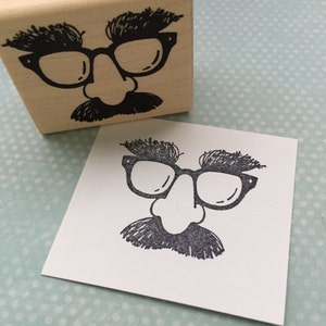Rubberstempel bril snor en neus
