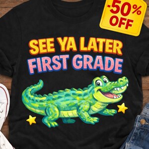 May include: Black t-shirt with a cartoon alligator and the text "SEE YA LATER FIRST GRADE." The shirt has a yellow price tag that says "-50% OFF." The words "SALE ON NOW" and "LIMITED TIME OFFER!" are also displayed.