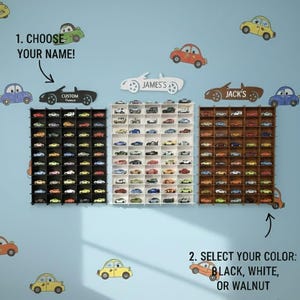 May include: A toy car display case in black, white, or walnut, with personalized nameplates. The image shows the text "1. CHOOSE YOUR NAME!" and "2. SELECT YOUR COLOR: BLACK, WHITE, OR WALNUT". The display is designed to hold toy cars.