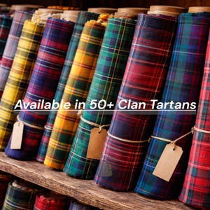 May include: A selection of rolled tartan fabric in a variety of colours, including red, green, blue, and yellow. Each roll is tied with twine and has a tag. The text "Available in 50+ Clan Tartans" is displayed.