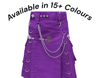 Könnte beinhalten: Ein violetter Kilt mit silbernen Metallakzenten, darunter Ketten und Ringe. Der Kilt hat Falten und Taschen, und der Text "Available in 15+ Colours" ist über dem Kleidungsstück angeordnet.