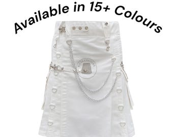May include: White kilt with silver-tone chain and hardware details. The kilt features multiple straps, D-rings, and a logo patch. Text on the image reads "Available in 15+ Colours".