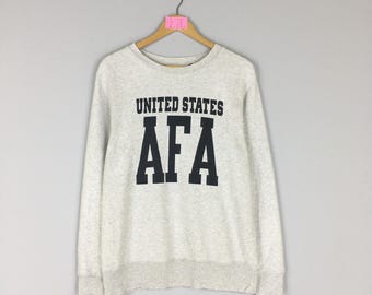 Sudadera vintage de cuello redondo AVIREX con logo grande Avirex Estados Unidos Jersey suéter Avirex unisex talla mediana