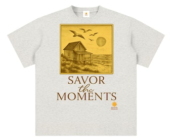 Unisex sueded cotton t‑shirt, peaceful coastal vibe, ocean breezes, seagulls, soft sunset colors. Savor the Moments TM
