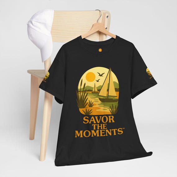 Sailboat Sunset Savor the Moments T‑Shirt with coastal vibe, sunlit bay, soaring birds, and sailing graphic tee design for ocean lovers.