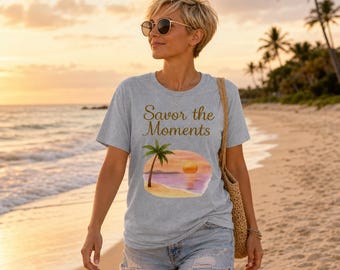 Essential Sorona boxy t‑shirt with beach style, palm trees, sunset colors, peaceful ocean vibe, and a soft tropical coastal feel.