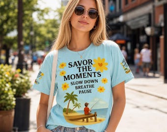 Coastal vibe snow-washed oversized, palm trees, ocean fishing scene, boy on pier artwork, uplifting “Savor the moments” message.